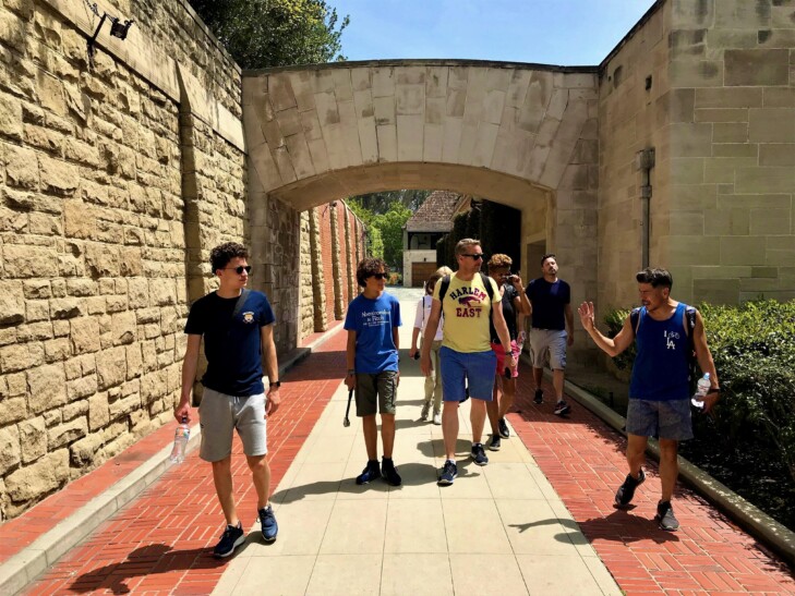 A group walks through Graystone Mansion in Los Angeles, California