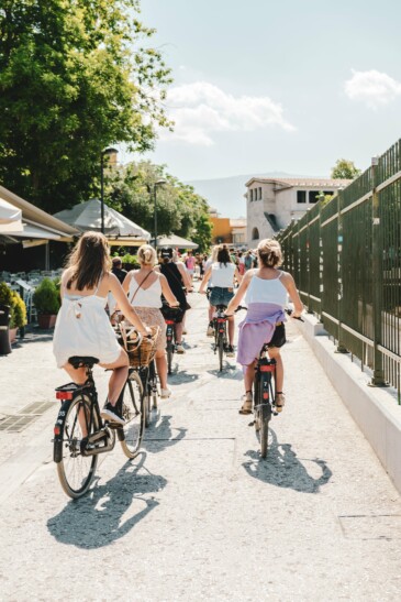 A group of cyclists ride along the streets of Athens, Greece