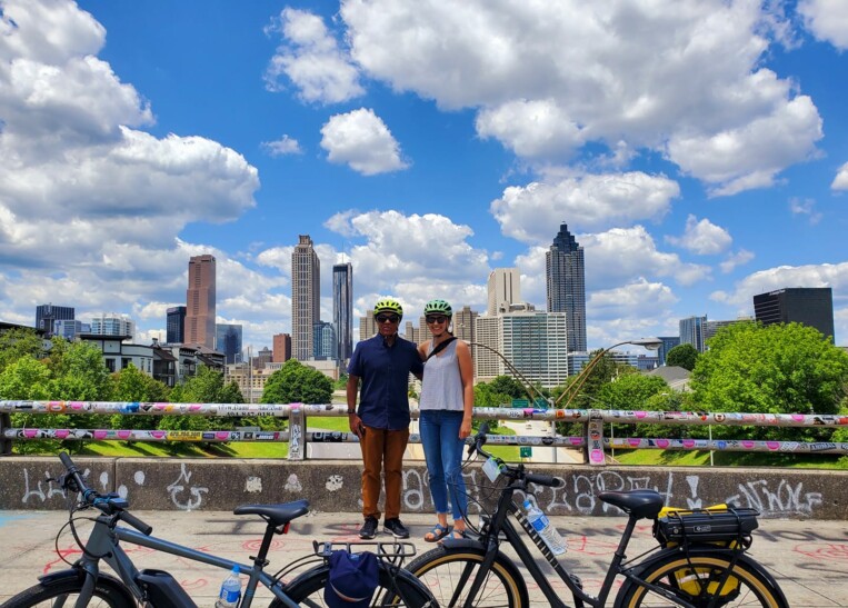 A couple poses for a photo on the Jackson Street Bridge in Atlanta, Georgia
