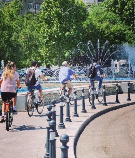 Cyclists ride through Union Square in Bucharest, Romania
