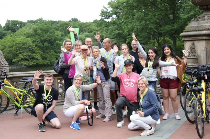 A group of cyclists stop for a photo in Central Park, New York City