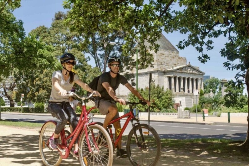 Two cyclists in a park in Melbourne, Australia