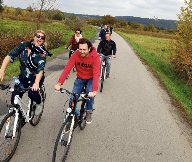 Cyclists ride along a path on the way to Tyniec Abbey outside Krakow, Poland