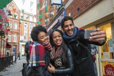 A group of friends pose for a photo in downtown Dublin, Ireland