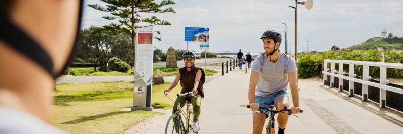 Riding along the boardwalk in Newcastle, Australia