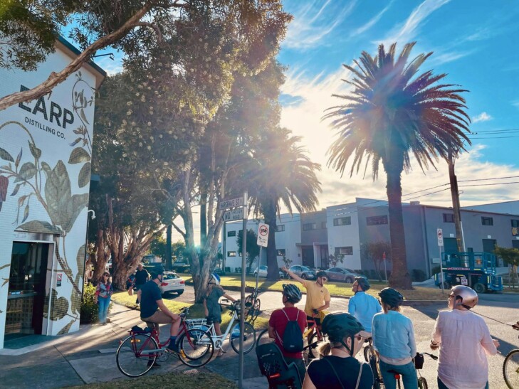 A group of cyclists on a sunny day in Newcastle, Australia