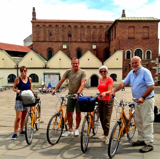 A group of cyclists in in the old Jewish quarter of Krakow, Poland