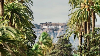 The Hollywood Sign among palm trees in Los Angeles