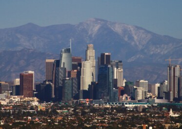 The skyscrapes of Los Angeles with the mountains in the background