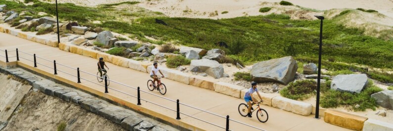 Riding along the beach in Newcastle, Australia