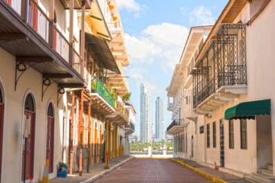 A view of skyscrapers at the end of a residential street in Panama City