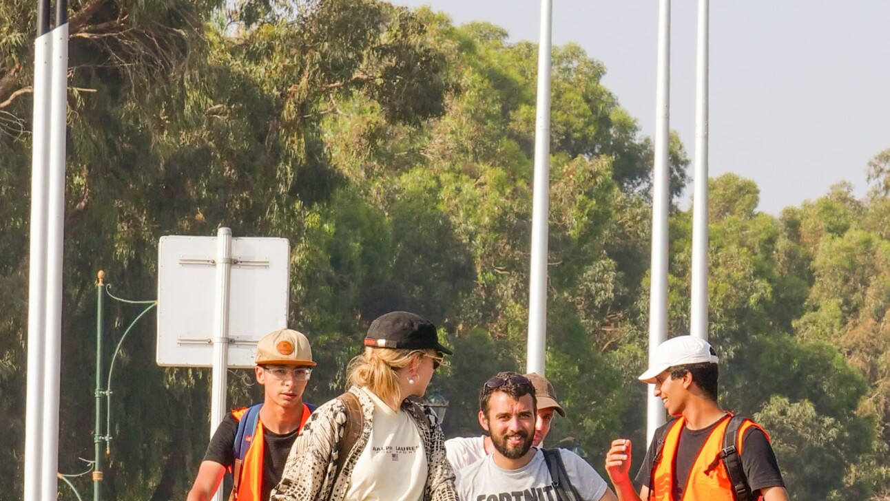 A group of cyclists stopped alongside a road