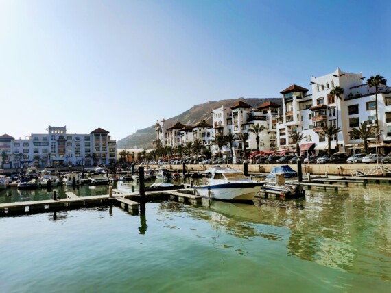 Boats and homes along the water in Agadir, Morocco
