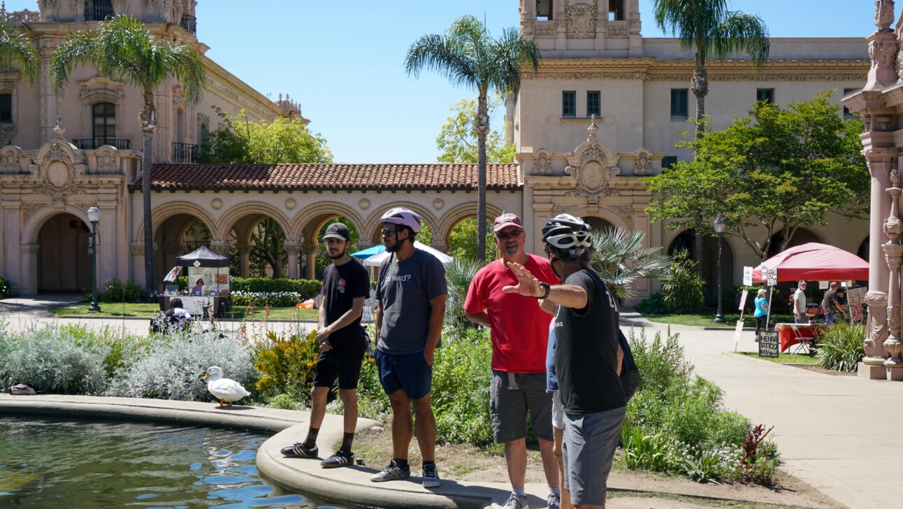 A guide explains the history of the Mission in San Diego